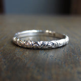 Contemporary ring: a White Gold Scrolling Pattern Band, Heirloom sold by Doyle & Doyle vintage and antique jewelry boutique.