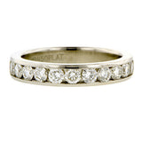 Estate ring: a Platinum Round Brilliant Cut Diamond Wedding Band sold by Doyle & Doyle vintage and antique jewelry boutique.