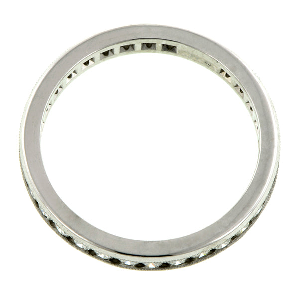 Contemporary ring; a Platinum Channel Set Round Brilliant Cut Diamond Eternity Band sold by Doyle & Doyle vintage and antique jewelry boutique.