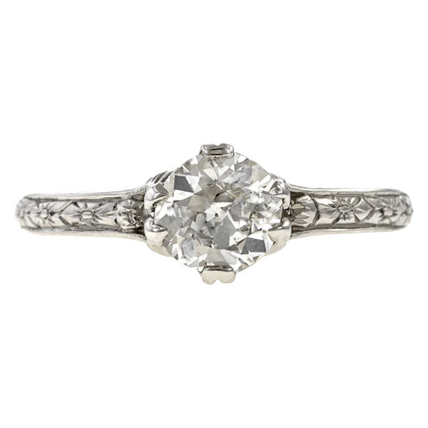 Contemporary ring; a Platinum Flower Engagement Ring, Old Euro 0.74ct sold by Doyle & Doyle vintage and antique jewelry boutique.