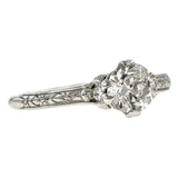 Contemporary ring; a Platinum Flower Engagement Ring, Old Euro 0.74ct sold by Doyle & Doyle vintage and antique jewelry boutique.