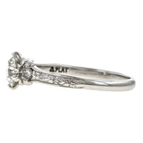 Contemporary ring; a Platinum Flower Engagement Ring, Old Euro 0.74ct sold by Doyle & Doyle vintage and antique jewelry boutique.