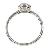 Contemporary ring; a Platinum Flower Engagement Ring, Old Euro 0.74ct sold by Doyle & Doyle vintage and antique jewelry boutique.